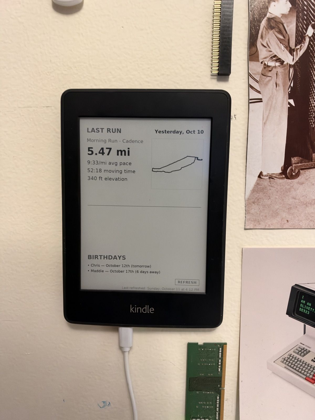 The Kindle on the wall showing my last run with a route map, and upcoming birthdays